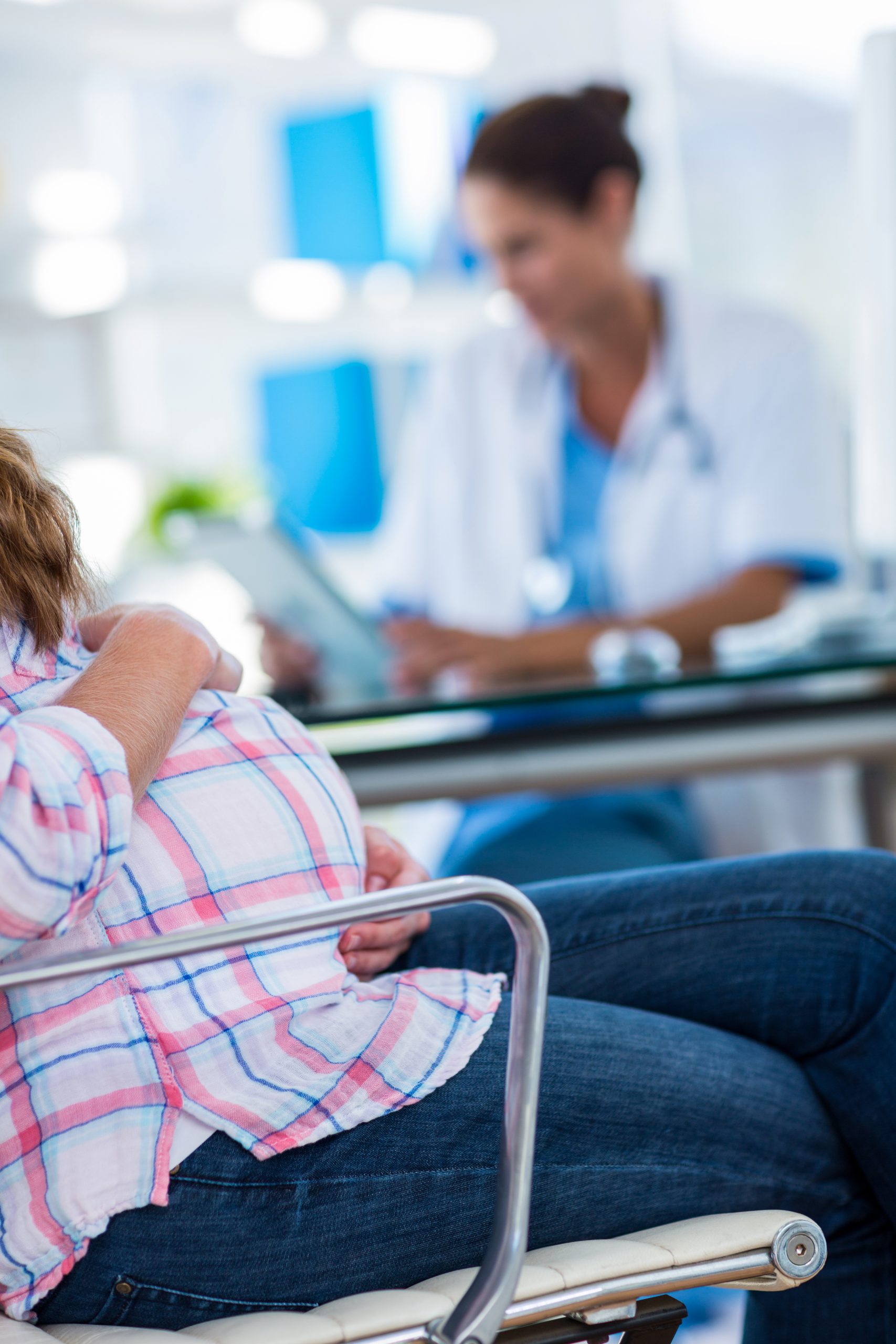 close-up-of-pregnant-woman-with-one-hand-on-belly